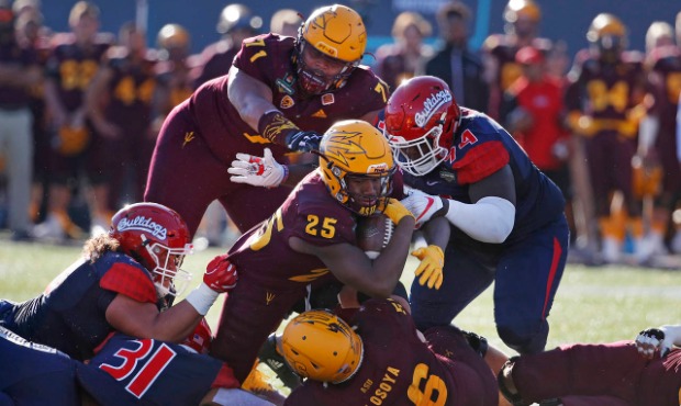 Arizona State A.J. Carter runs for a gain against Fresno State during the first half of the Las Veg...