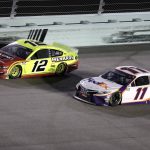 Ryan Blaney (12) and Denny Hamlin (11) battle for the lead during a NASCAR Cup Series auto race Sunday, June 14, 2020, in Homestead, Fla. (AP Photo/Wilfredo Lee)