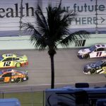 Ryan Blaney (12), Chase Elliott (9), Denny Hamlin (11) and Tyler Reddick (8) come through a turn during a NASCAR Cup Series auto race Sunday, June 14, 2020, in Homestead, Fla. (AP Photo/Wilfredo Lee)