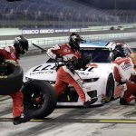 Alex Bowman makes a pit stop during a NASCAR Cup Series auto race Sunday, June 14, 2020, in Homestead, Fla. (AP Photo/Wilfredo Lee)