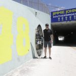 Driver Jimmie Johnson poses at a tunnel named for him at Homestead-Miami Speedway before a NASCAR Cup Series auto race Sunday, June 14, 2020, in Homestead, Fla. (AP Photo/Wilfredo Lee)