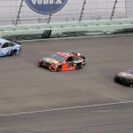 Kevin Harvick (4), Martin Truex Jr. (19) and Chase Elliott (9) come through a turn during a NASCAR Cup Series auto race Sunday, June 14, 2020, in Homestead, Fla. (AP Photo/Wilfredo Lee)