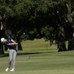 Daniel Berger takes a shot on the 17th fairway during a playoff round at the Charles Schwab Challenge golf tournament at the Colonial Country Club in Fort Worth, Texas, Sunday, June 14, 2020. (AP Photo/David J. Phillip)