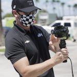 Driver Jimmie Johnson takes pictures of a tunnel named for him at Homestead-Miami Speedway before a NASCAR Cup Series auto race Sunday, June 14, 2020, in Homestead, Fla. (AP Photo/Wilfredo Lee)