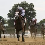 Tiz the Law, center, with jockey Manny Franco up, crosses the finish line to win the152nd running of the Belmont Stakes horse race, Saturday, June 20, 2020, in Elmont, N.Y. (AP Photo/Seth Wenig)