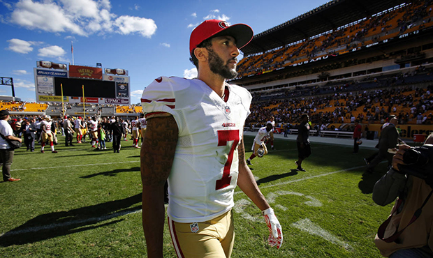 San Francisco 49ers quarterback Colin Kaepernick (7) walks off the field after an NFL football game...