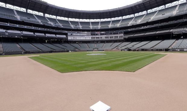 Second base sits in its place in an otherwise empty ballpark where grounds crew members continue to...