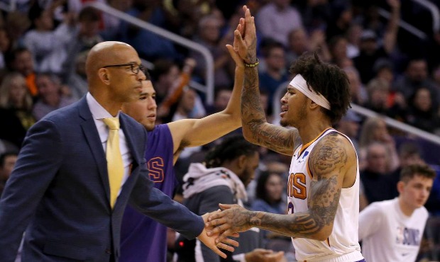 Phoenix Suns forward Kelly Oubre Jr., right, celebrates his 3-pointer with head coach Monty William...