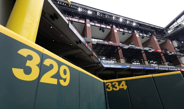 Distance markers on the outfield wall and the foul pole, top left, frame the upper center field con...