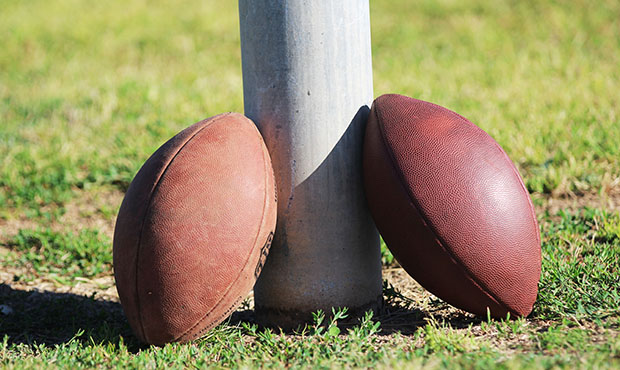 Two footballs sit on a field-goal post on Thursday, April 6, 2017 at Basha High School in Chandler,...