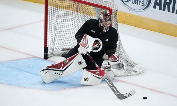 Goaltender Antti Raanta #32 of the Arizona Coyotes controls the puck as he participates in a NHL te...