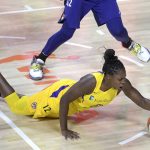 Los Angeles Sparks guard Chelsea Gray (12) falls to the court after getting tripped on a play during the first half of a WNBA basketball game against the Phoenix Mercury, Saturday, July 25, 2020, in Ellenton, Fla. (AP Photo/Phelan M. Ebenhack)