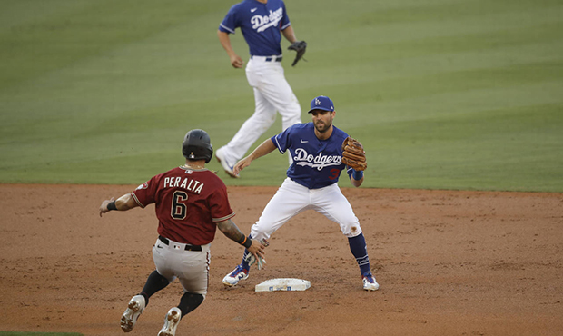 Arizona Diamondbacks' David Peralta (6) is picked off trying to steal second base by Los Angeles Do...