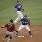 Arizona Diamondbacks' David Peralta (6) is picked off trying to steal second base by Los Angeles Dodgers second baseman Chris Taylor during the second inning of an exhibition baseball game Monday, July 20, 2020, in Los Angeles. (AP Photo/Marcio Jose Sanchez)