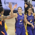 Phoenix Mercury guard Diana Taurasi (3) is congratulated by center Brittney Griner, left, and Skylar Diggins-Smith (4) after scoring a basket during the first half of a WNBA basketball game against the Los Angeles Sparks, Saturday, July 25, 2020, in Ellenton, Fla. (AP Photo/Phelan M. Ebenhack)