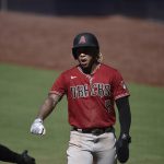 Arizona Diamondbacks' Ketel Marte is congratulated after scoring a run during the eighth inning of the team's baseball game against the San Diego Padres in San Diego, Sunday, July 26, 2020. The Diamondbacks won 4-3. (AP Photo/Kelvin Kuo)