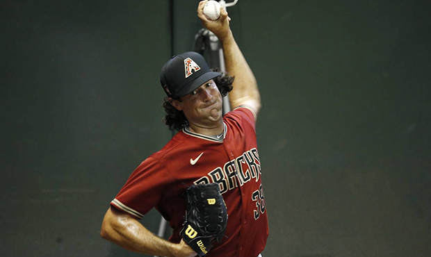 Arizona Diamondbacks starting pitcher Robbie Ray warms up in the bullpen during team practice at Ch...
