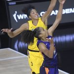 Phoenix Mercury guard Skylar Diggins-Smith (4) goes up for a shot in front of Los Angeles Sparks forward Candace Parker (3) during the second half of a WNBA basketball game, Saturday, July 25, 2020, in Ellenton, Fla. (AP Photo/Phelan M. Ebenhack)
