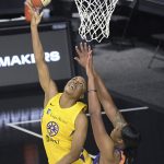 Los Angeles Sparks forward Kristine Anigwe, left, goes up for a shot in front of Phoenix Mercury center Kia Vaughn (1) during the first half of a WNBA basketball game, Saturday, July 25, 2020, in Ellenton, Fla. (AP Photo/Phelan M. Ebenhack)