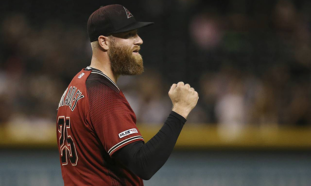 Arizona Diamondbacks relief pitcher Archie Bradley pumps his fist as he watches the final out by th...