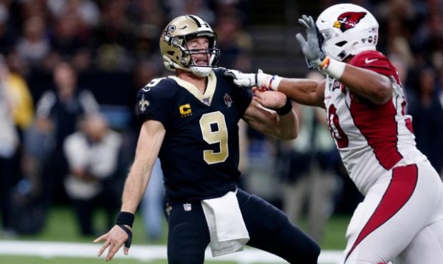 New Orleans Saints quarterback Drew Brees (9) is pressured by Arizona Cardinals defensive end Jonat...