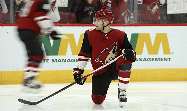 Arizona Coyotes left wing Taylor Hall warms up with teammates prior to an NHL hockey game against t...