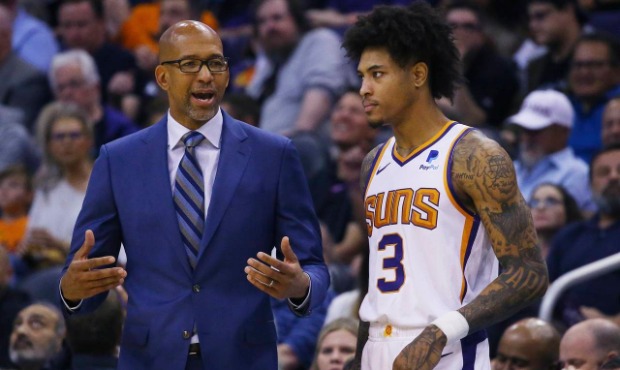 Phoenix Suns head coach Monty Williams, left, talks with Suns forward Kelly Oubre Jr. (3) during th...