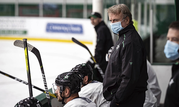 In this photo provided by the Dallas Stars NHL hockey team, interim head coach Rick Bowness watches...