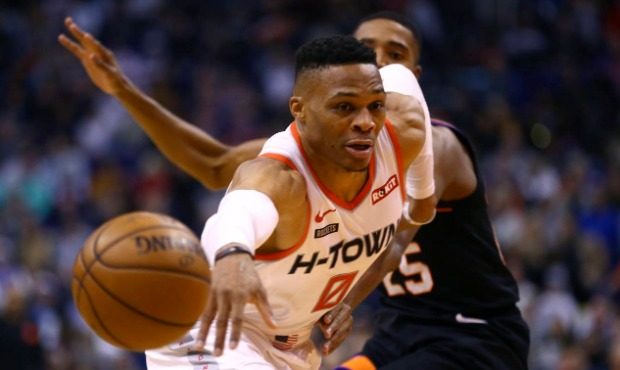Houston Rockets guard Russell Westbrook (0) loses the ball as Phoenix Suns forward Mikal Bridges, r...