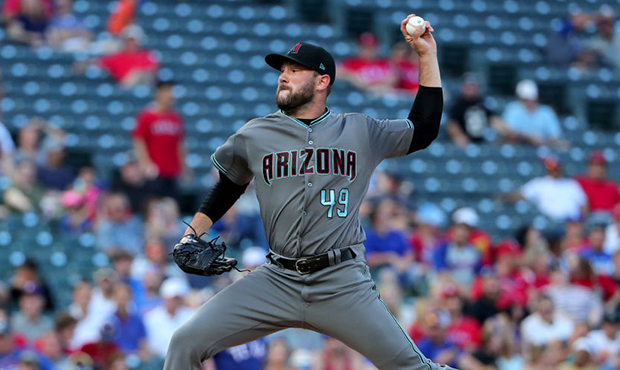 Alex Young #49 of the Arizona Diamondbacks pitches against the Texas Rangers in the bottom of the f...