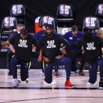 The Indiana Pacers team takes a knee during the national anthem prior to the start of the NBA basketball game against the Phoenix Suns Thursday, Aug. 6, 2020, in Lake Buena Vista, Fla. (Kevin C. Cox/Pool Photo via AP)