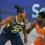 Indiana Pacers' Myles Turner (33)  handles the ball as Phoenix Suns' Deandre Ayton (22) defends during the first half of an NBA basketball game Thursday, Aug. 6, 2020, in Lake Buena Vista, Fla. (Kevin C. Cox/Pool Photo via AP)