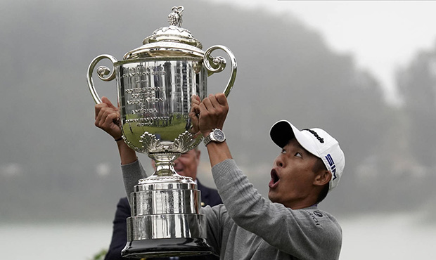 Collin Morikawa reacts as the top of the Wanamaker Trophy falls after winning the PGA Championship ...