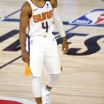 Phoenix Suns' Jevon Carter (4) looks on against the Oklahoma City Thunder during the first quarter of an NBA basketball game Monday, Aug. 10, 2020, in Lake Buena Vista, Fla. (Mike Ehrmann/Pool Photo via AP)