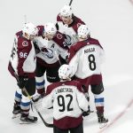 Colorado Avalanche players celebrate a goal against the Arizona Coyotes during third-period NHL Western Conference Stanley Cup playoff hockey game action in Edmonton, Alberta, Monday, Aug. 17, 2020. (Jason Franson/The Canadian Press via AP)