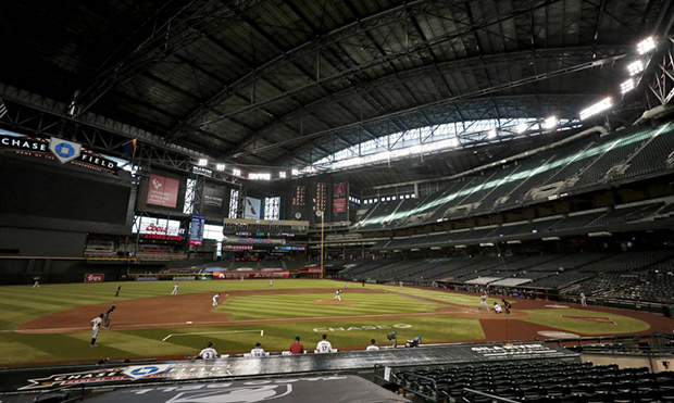 The Houston Astros and the Arizona Diamondbacks compete in an empty Chase Field during the seventh ...