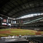 The Houston Astros and the Arizona Diamondbacks compete in an empty Chase Field during the seventh inning of a baseball game Thursday, Aug. 6, 2020, in Phoenix. (AP Photo/Matt York)