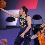 Indiana Pacers' T.J. McConnell (9) drives the ball past Phoenix Suns' Ricky Rubio (11) during the first half of an NBA basketball game Thursday, Aug. 6, 2020, in Lake Buena Vista, Fla. (Kevin C. Cox/Pool Photo via AP)