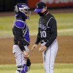 Colorado Rockies manager Bud Black (10) and catcher Tony Wolters talk on the mound while waiting on a pitching change during the seventh inning of a baseball game against the Arizona Diamondbacks, Monday, Aug. 24, 2020, in Phoenix. (AP Photo/Matt York)