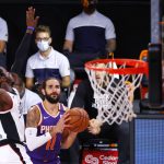 Phoenix Suns' Ricky Rubio (11) of the Phoenix Suns looks to take a shot against Los Angeles Clippers' Reggie Jackson during an NBA basketball game Tuesday, Aug. 4, 2020, in Lake Buena Vista, Fla. (Kevin C. Cox/Pool Photo via AP)
