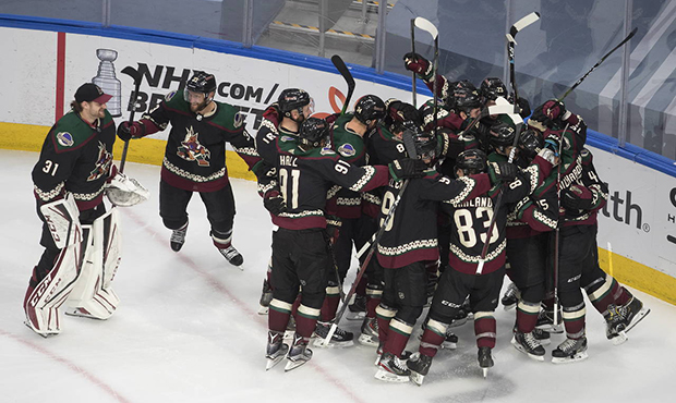Arizona Coyotes celebrate their win over the Nashville Predators following overtime of an NHL hocke...