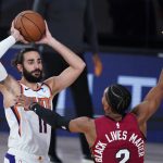 Phoenix Suns' Ricky Rubio (11) looks to pass as Miami Heat guard Gabe Vincent (2) defends during the second half of an NBA basketball game, Saturday, Aug. 8, 2020, in Lake Buena Vista, Fla. (AP Photo/Ashley Landis, Pool)