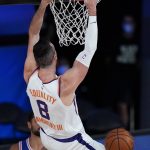 Phoenix Suns center Frank Kaminsky (8) slams home a dunk during the first half of an NBA basketball game Tuesday, Aug. 11, 2020, in Lake Buena Vista, Fla. (AP Photo/Ashley Landis, Pool)