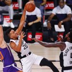 Phoenix Suns' Dario Saric (20)  wins a rebound over Los Angeles Clippers' Landry Shamet (20) during an NBA basketball game Tuesday, Aug. 4, 2020, in Lake Buena Vista, Fla. (Kevin C. Cox/Pool Photo via AP)