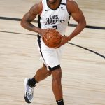 Los Angeles Clippers' Kawhi Leonard dribbles down court against the Phoenix Suns during the first half of an NBA basketball game against the Phoenix Suns' Tuesday, Aug. 4, 2020, in Lake Buena Vista, Fla. (Kevin C. Cox/Pool Photo via AP)