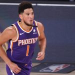 Phoenix Suns Devin Booker runs down court during the first half of an NBA basketball game against the Los Angeles Clippers Tuesday, Aug. 4, 2020, in Lake Buena Vista, Fla. (Kevin C. Cox/Pool Photo via AP)