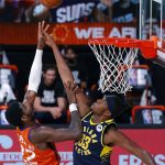 Phoenix Suns' Deandre Ayton (22) shoots the ball as Indiana Pacers' Myles Turner (33) defends during the first half of an NBA basketball game Thursday, Aug. 6, 2020, in Lake Buena Vista, Fla. (Kevin C. Cox/Pool Photo via AP)