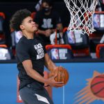 Phoenix Suns' Cameron Johnson warms up prior to the start of an NBA basketball game against the Indiana Pacers Thursday, Aug. 6, 2020, in Lake Buena Vista, Fla. (Kevin C. Cox/Pool Photo via AP)