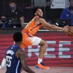 Phoenix Suns guard Cameron Payne (15) attempts to save the ball from going out of bounds against the Dallas Mavericks during the second half of an NBA basketball game Sunday, Aug. 2, 2020, in Lake Buena Vista, Fla. (AP Photo/Ashley Landis, Pool)