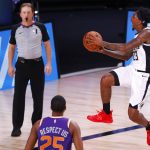 Lou Williams, right,  of the Los Angeles Clippers takes a shot against the Phoenix Suns during an NBA basketball game Tuesday, Aug. 4, 2020, in Lake Buena Vista, Fla. (Kevin C. Cox/Pool Photo via AP)